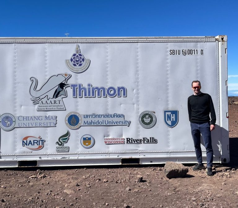 Dr Michael Aspinall stood outside the HLEA (6-NM-64) and Thimon (3-NM-64) neutron monitors at the summit of Haleakalā, as part of the the Haleakalā Neutron Monitor Workshop and Ribbon Cutting Ceremony, Hawaii, 5-9 Jan 2025. Dr Michael Aspinall stood outside the HLEA (6-NM-64) and Thimon (3-NM-64) neutron monitors at the summit of Haleakalā, Hawaii.